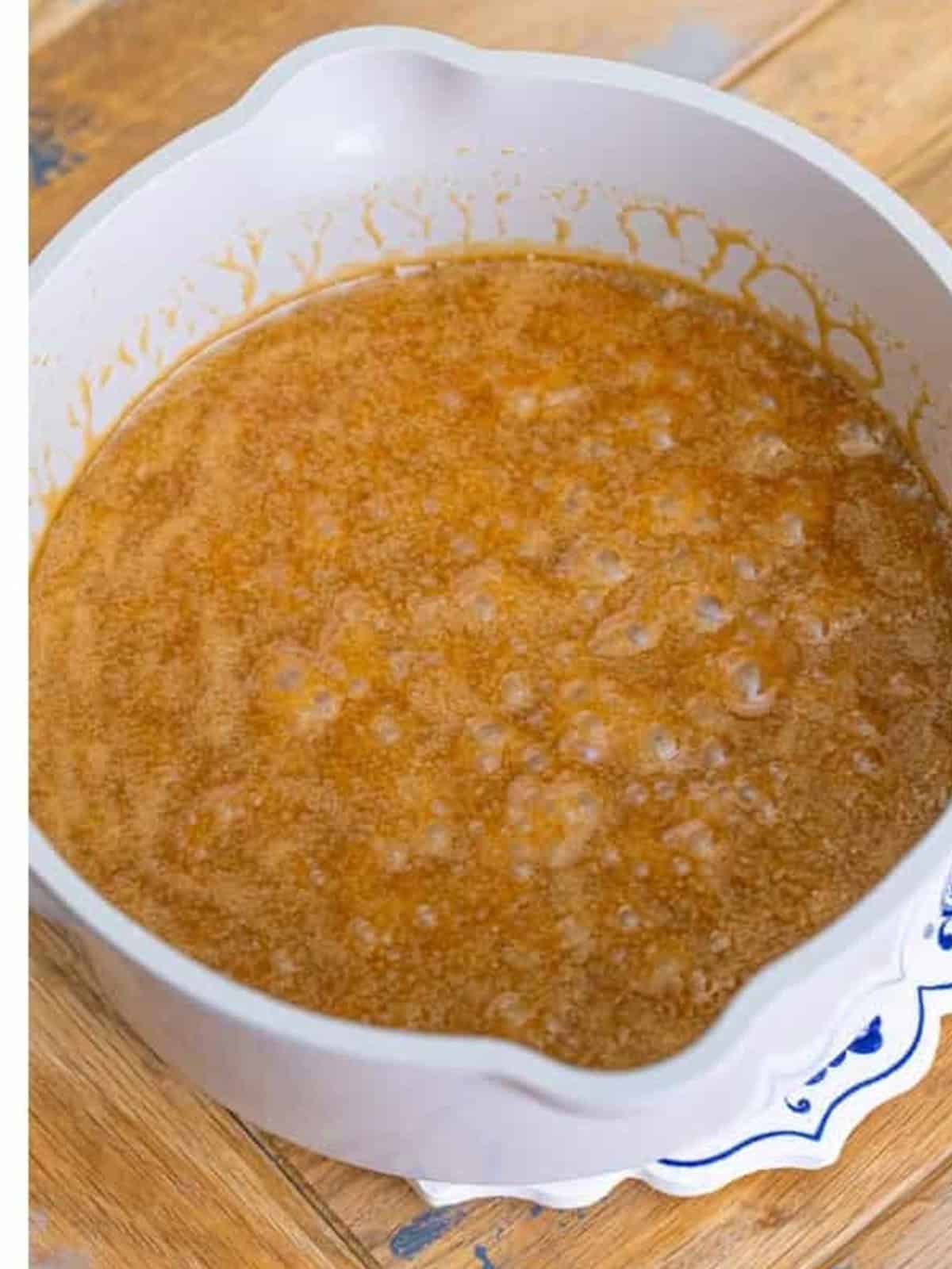 Brown sugar and butter simmered into a caramel in a saucepan.