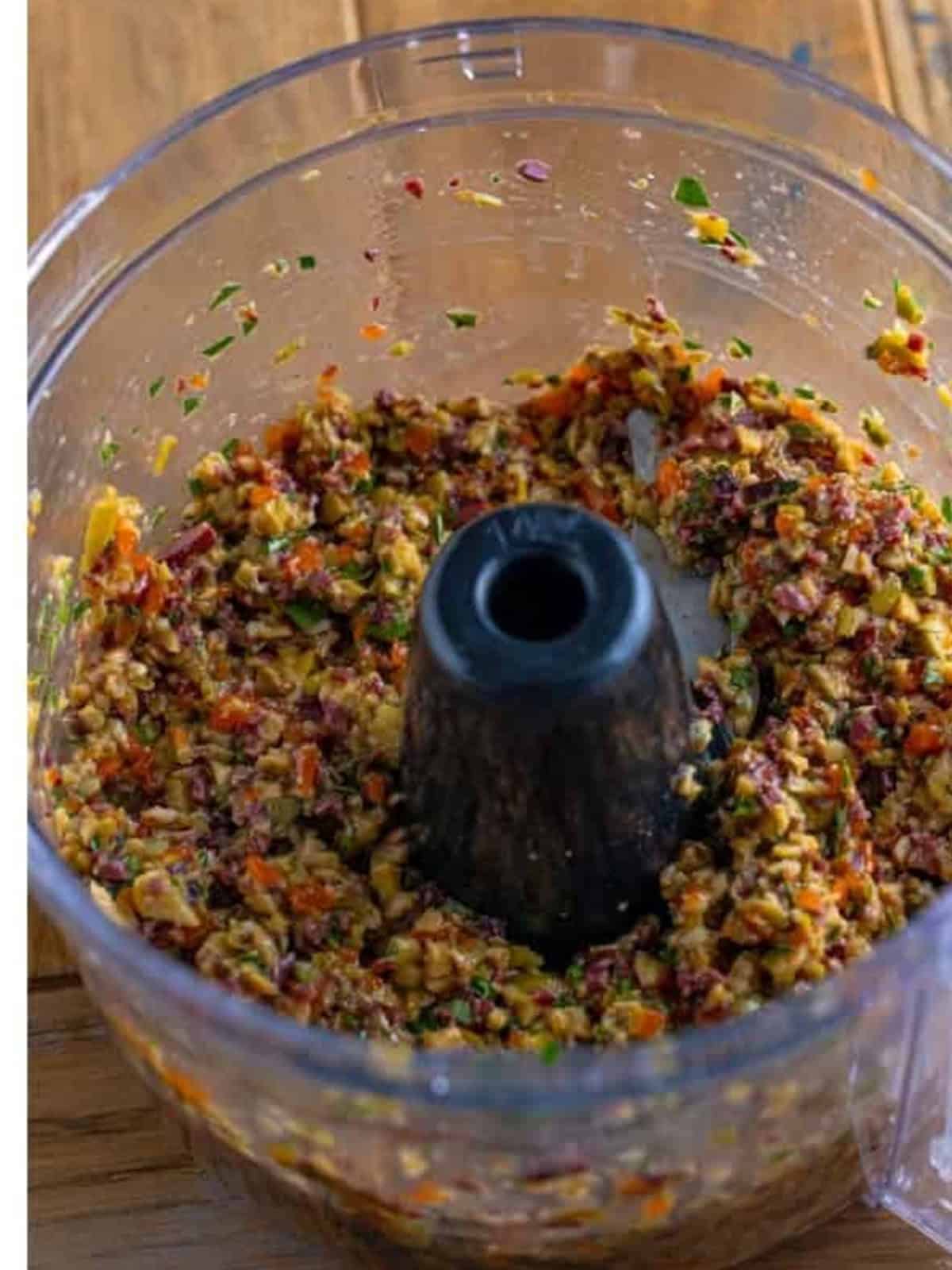 Finished olive tapenade pulsed to a slightly chunky consistency in the food processor.