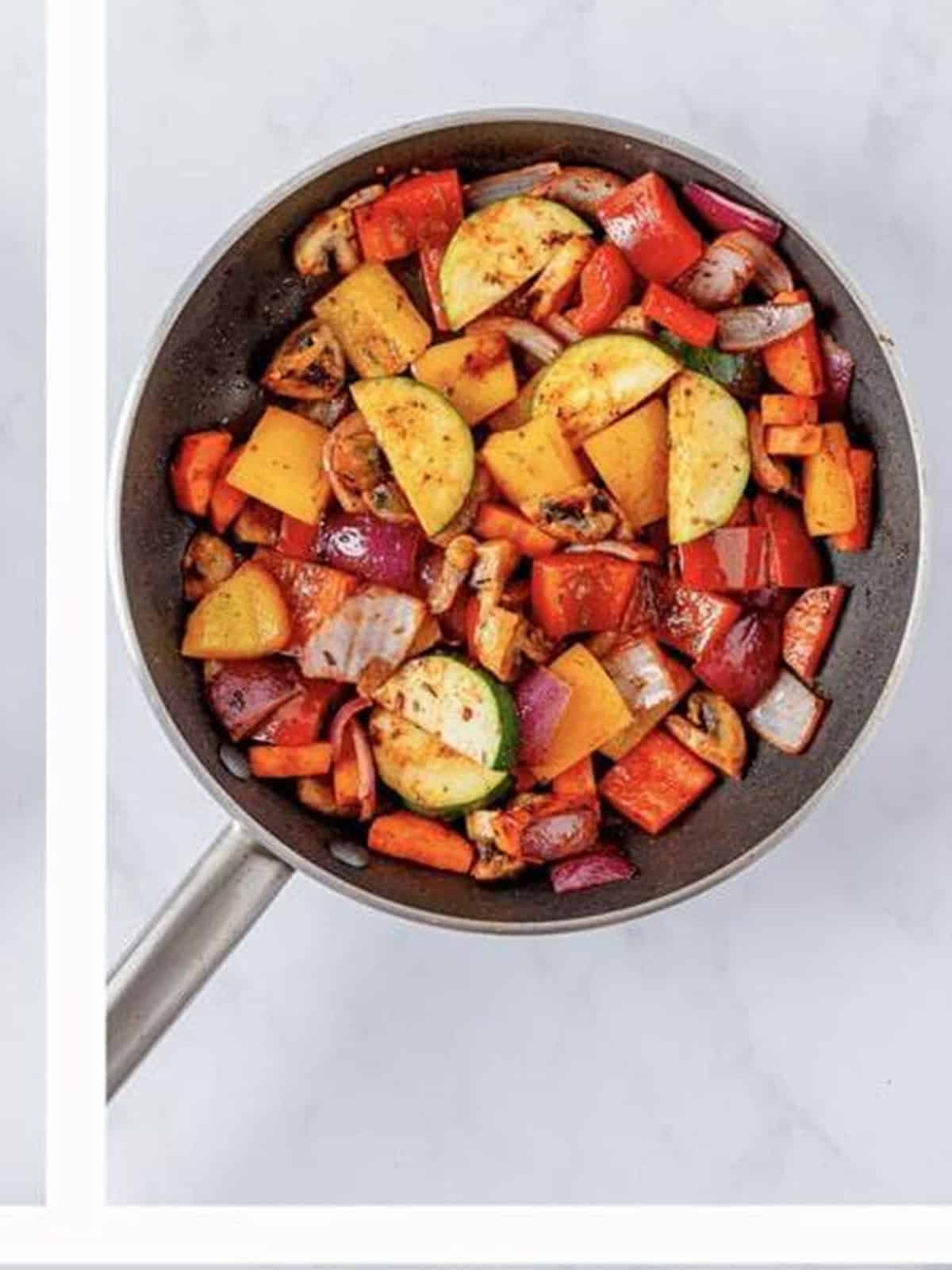 Onion and bell peppers sauteing in the same skillet.