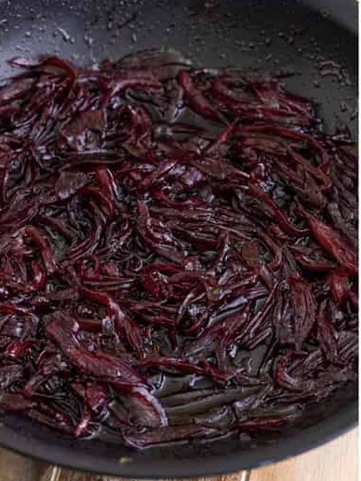 Red onion marmalade simmered down into a jammy, deep purple condiment.