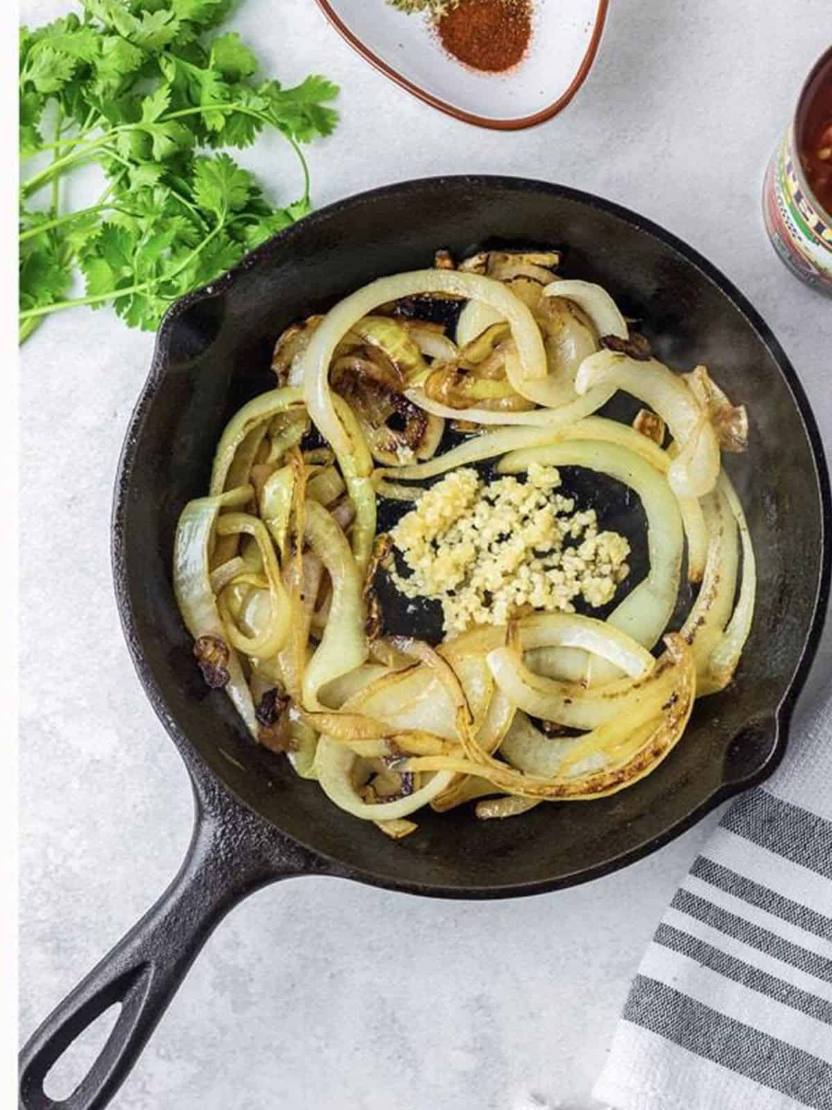 Onions cooked down and browned in the skillet with garlic.