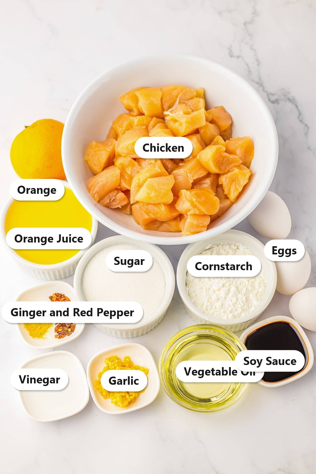 Orange Chicken ingredients labeled: chicken, orange, orange juice, eggs, sugar, cornstarch, ginger, red pepper, vinegar, garlic, oil, and soy sauce.