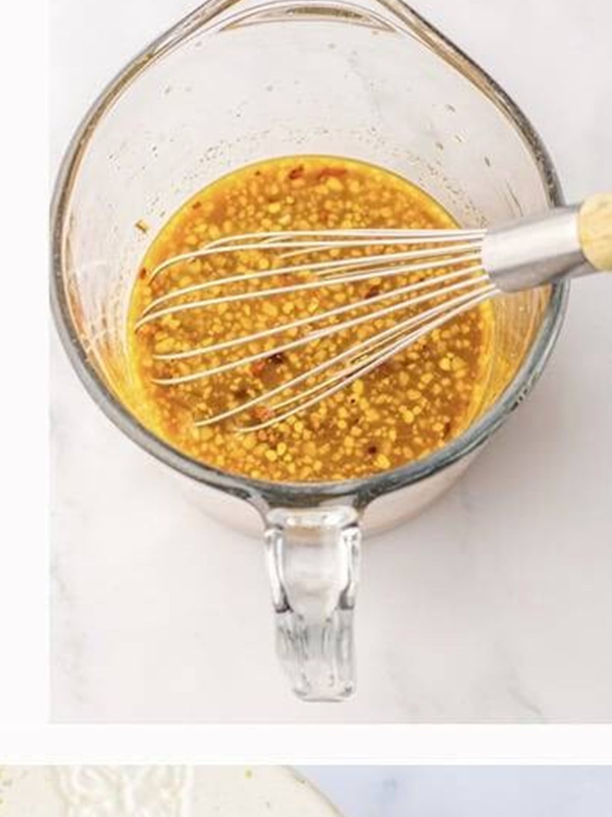 Orange Chicken sauce whisked together in a bowl.