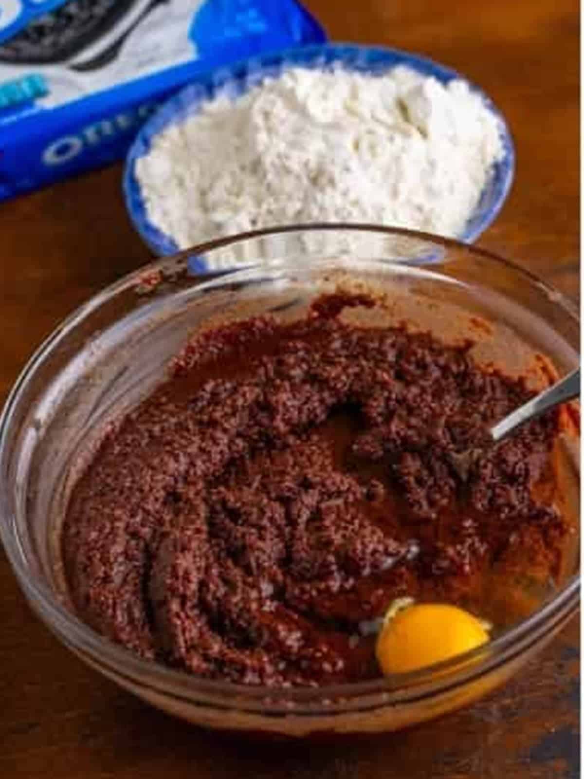 Eggs beaten one at a time into the chocolate brownie batter.