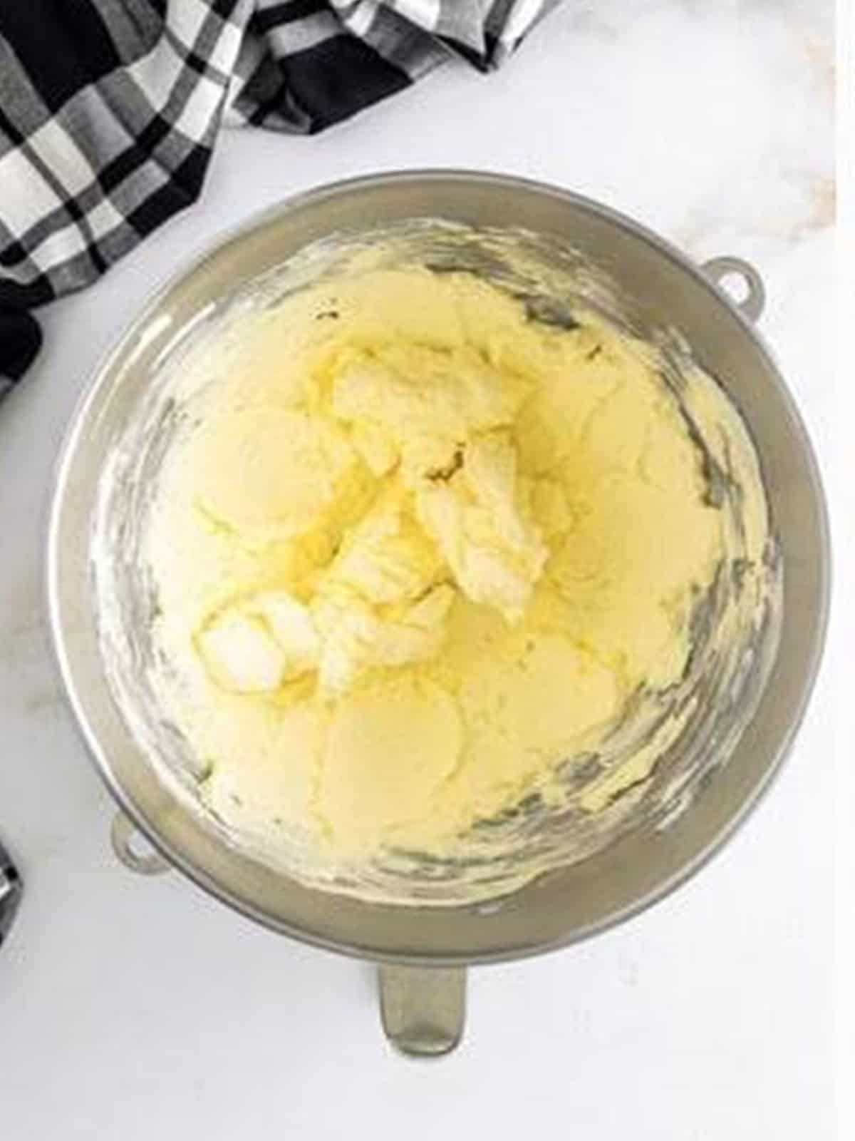 Butter and cream cheese creamed together in a stand mixer for Oreo buttercream.
