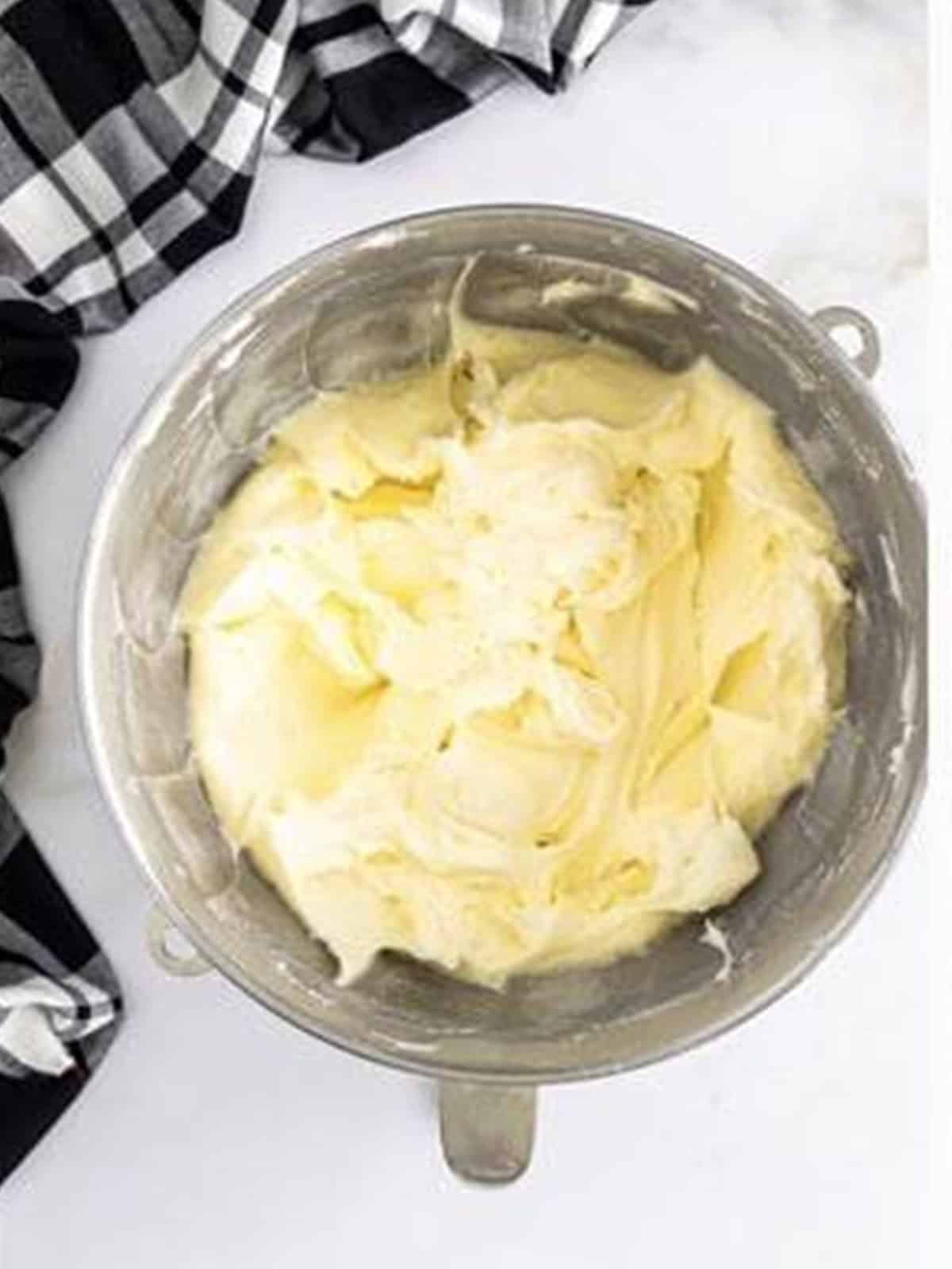Light and fluffy whipped buttercream after adding powdered sugar, cream, and vanilla.