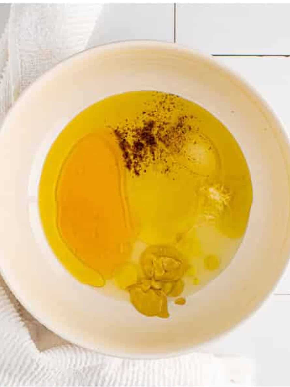Dressing ingredients in the bottom of a mixing bowl