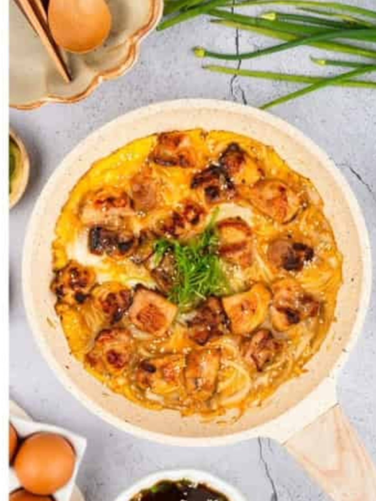 Finished oyakodon with soft-set egg and chicken ready to serve over rice.