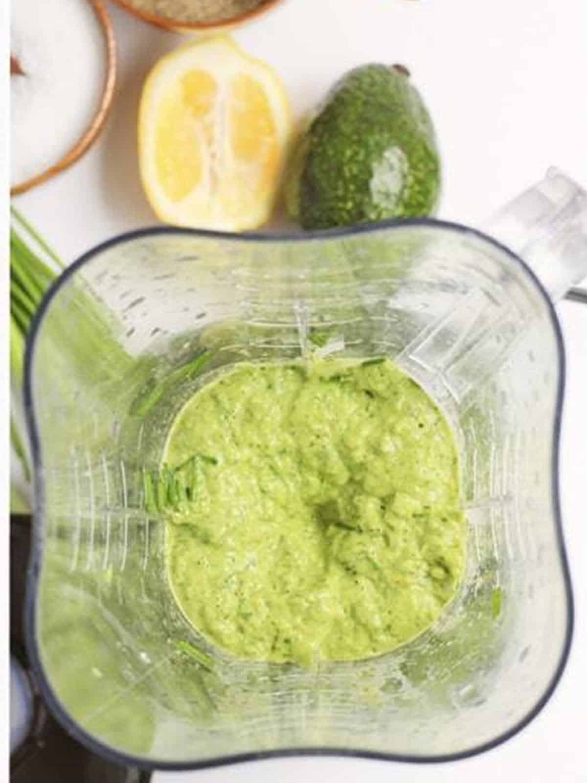 Green goddess dressing blended smooth in a blender.