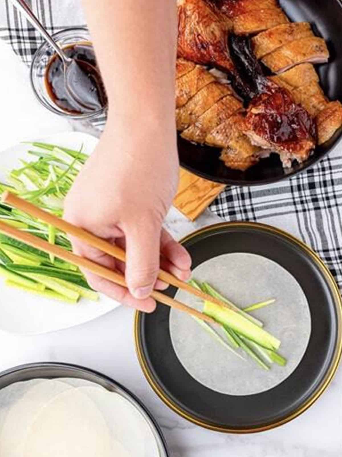 Cucumbers and scallions sliced into matchsticks with a Peking duck pancake.