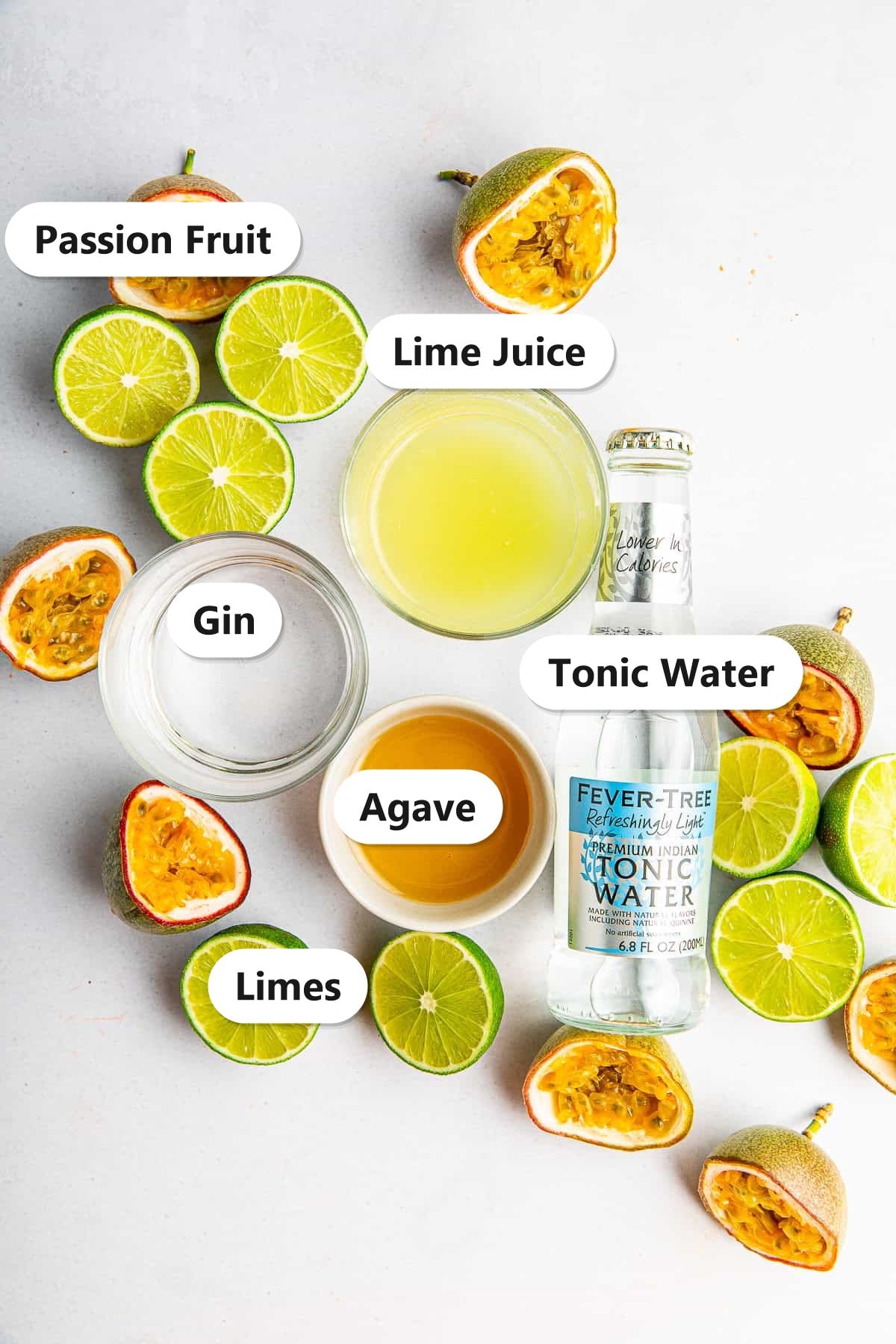 Labeled ingredients for passion fruit gin fizz including passion fruit, lime juice, gin, agave, and tonic water.