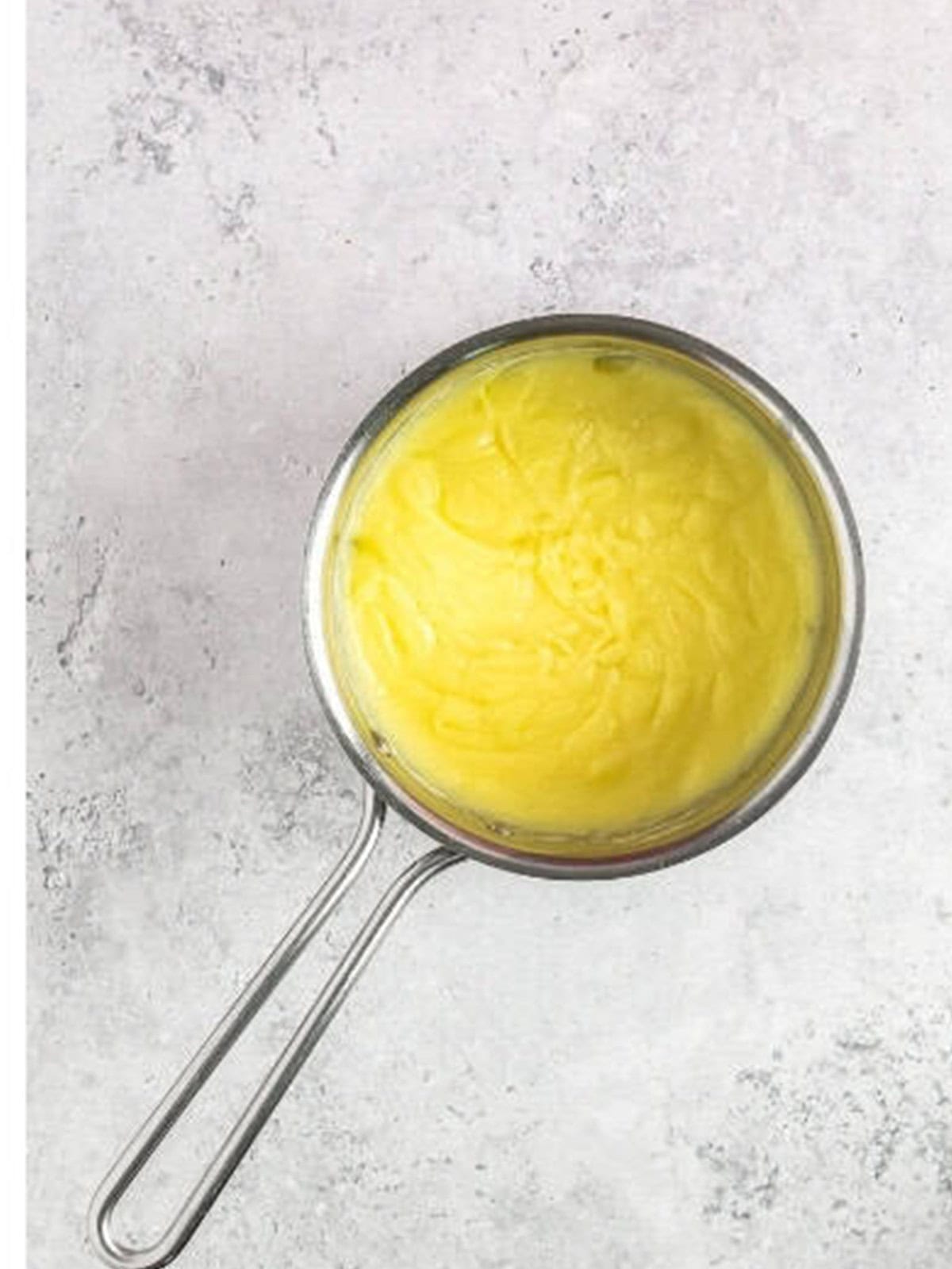 Smooth finished pastry cream ready to chill.