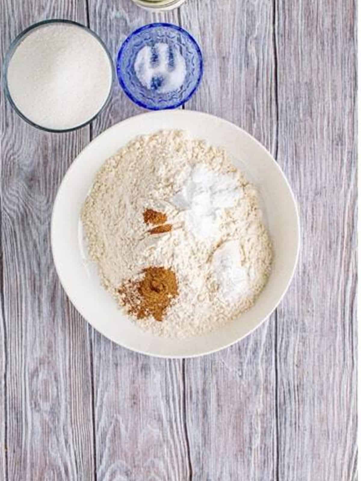 Dry ingredients for peach bread whisked together in a bowl.