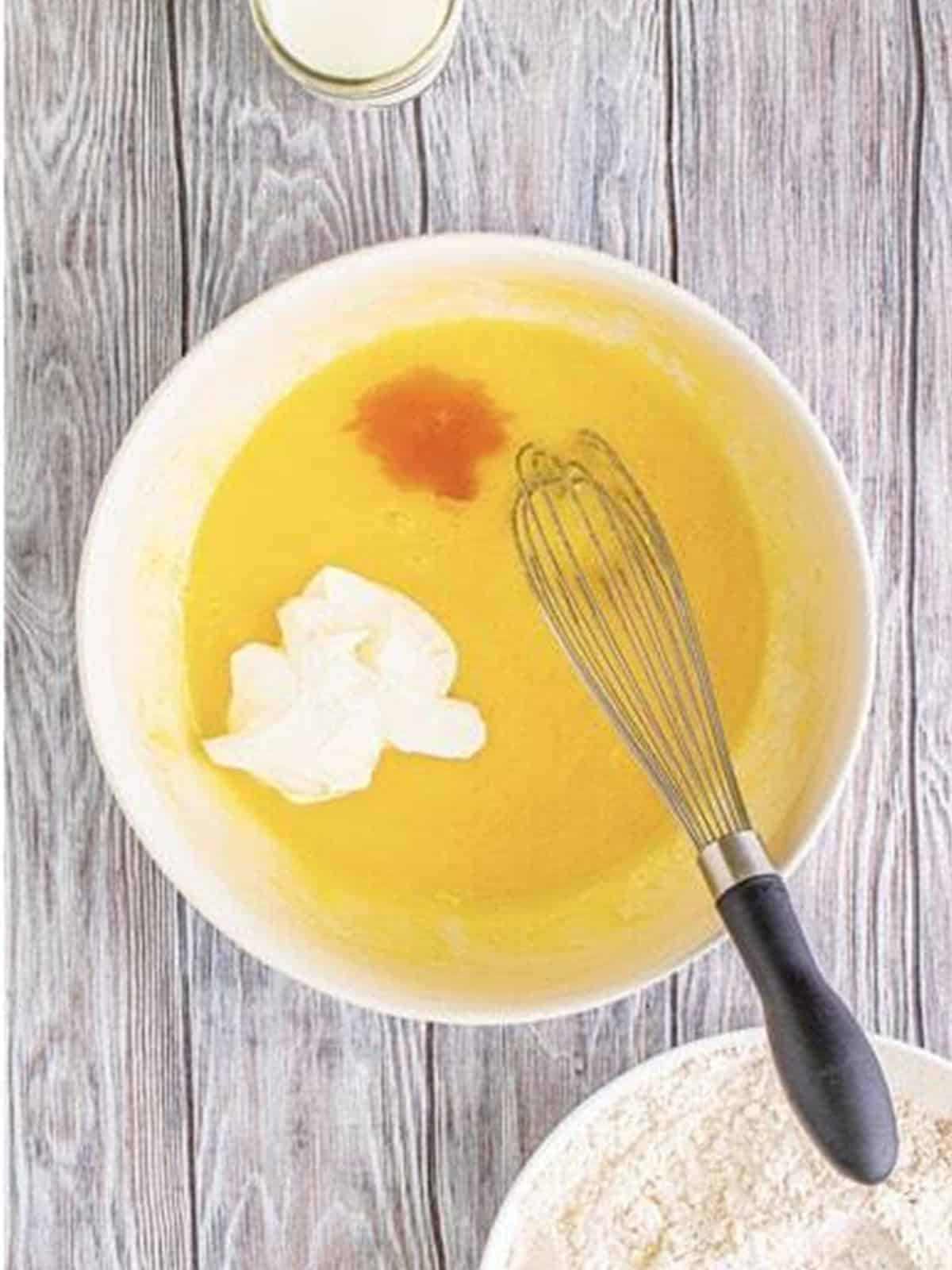 Egg, sour cream, and vanilla added to the wet ingredients.
