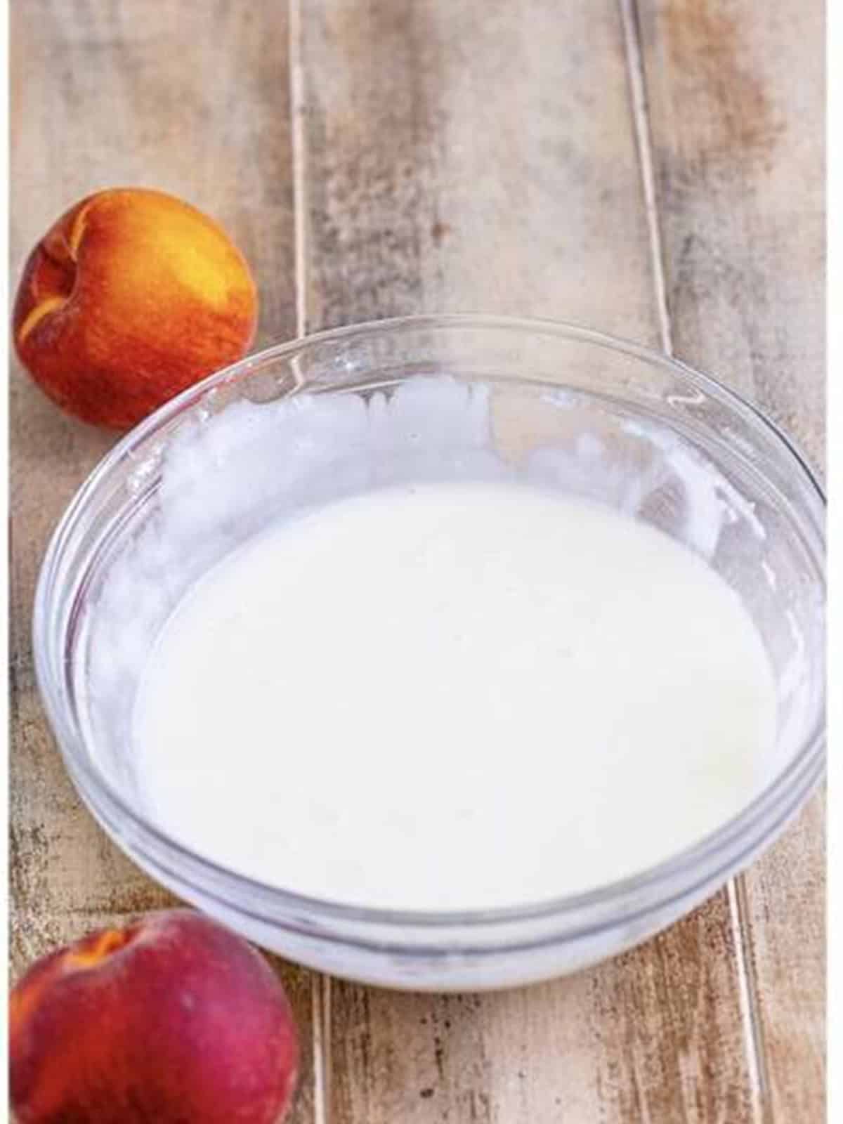 Whisking the glaze for Peach Fritters.