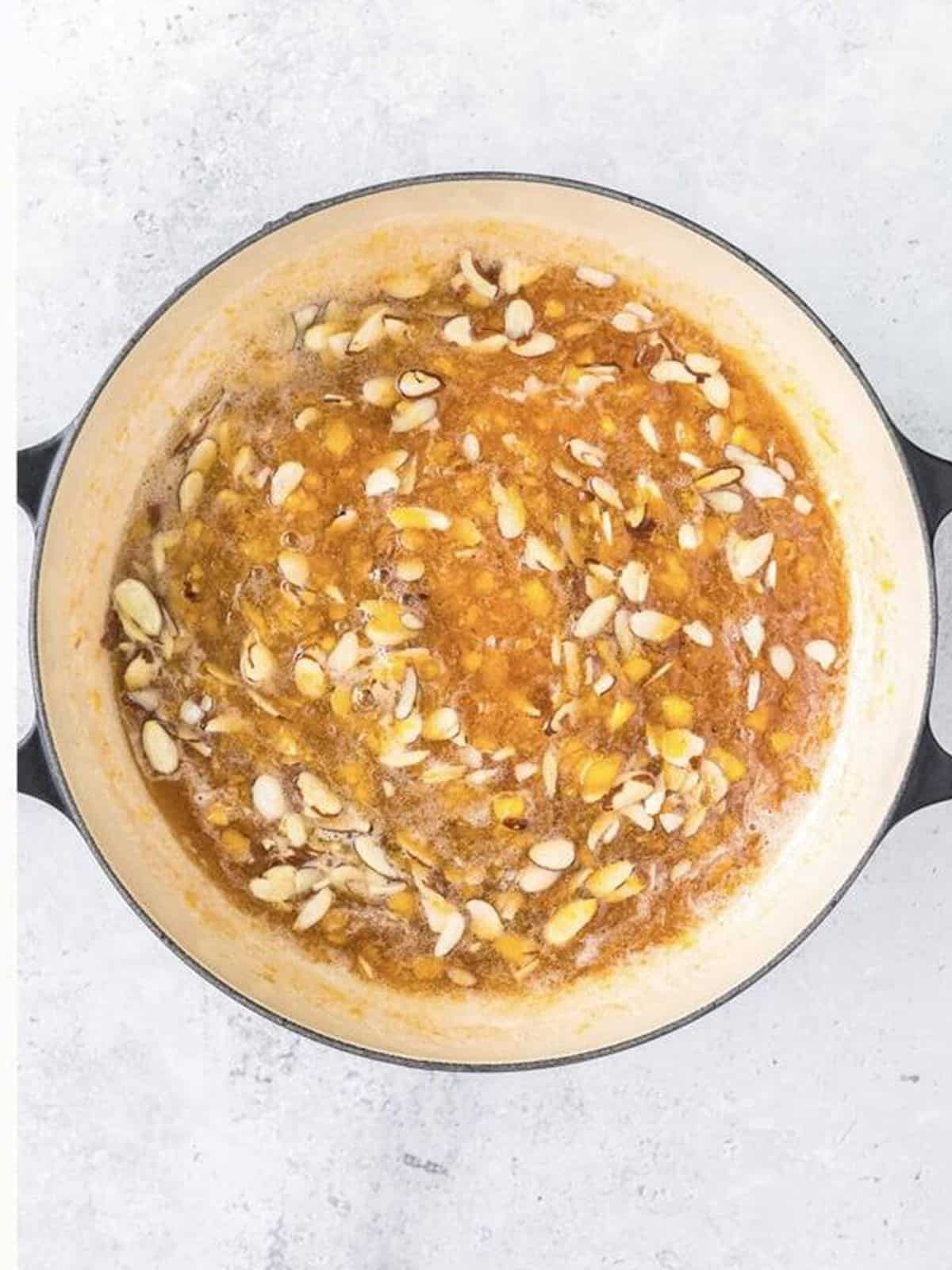 Toasted sliced almonds stirred into the finished peach jam.