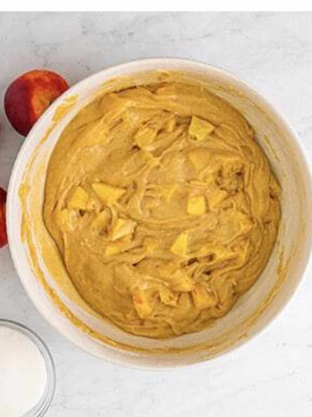 Chopped fresh peaches folded into the muffin batter.