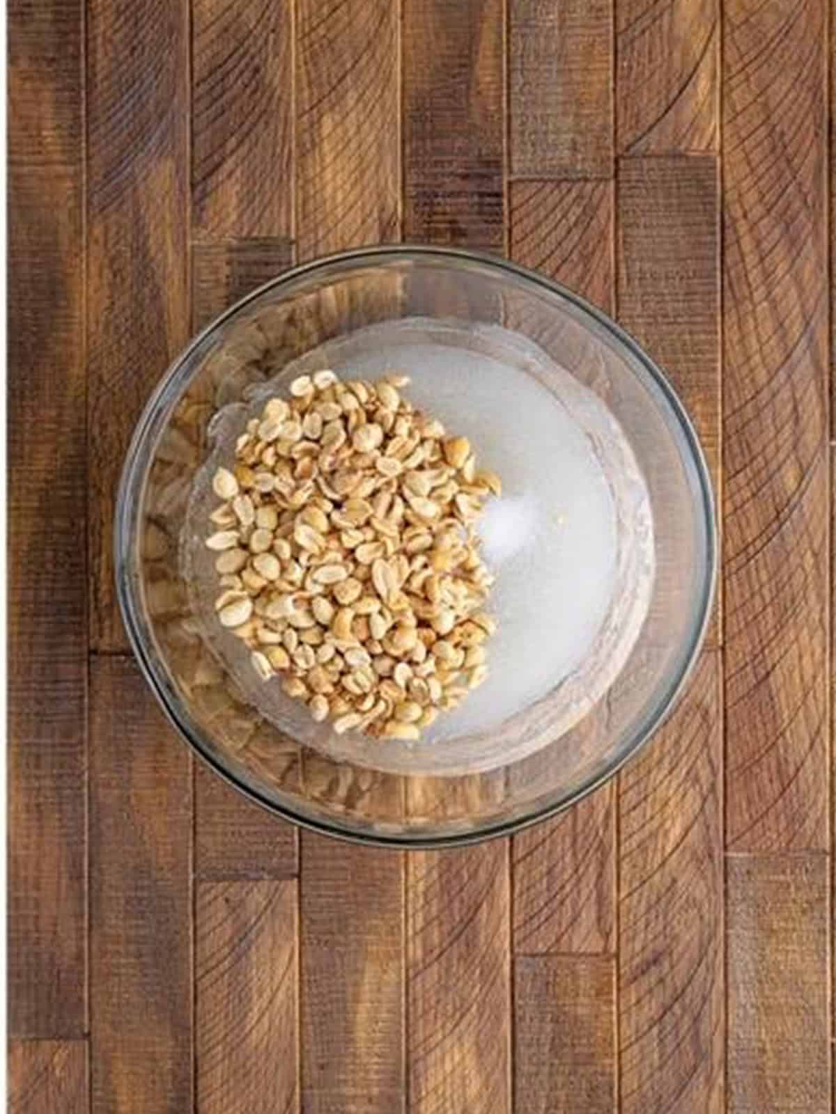Dry roasted peanuts stirred into the hot melted syrup.