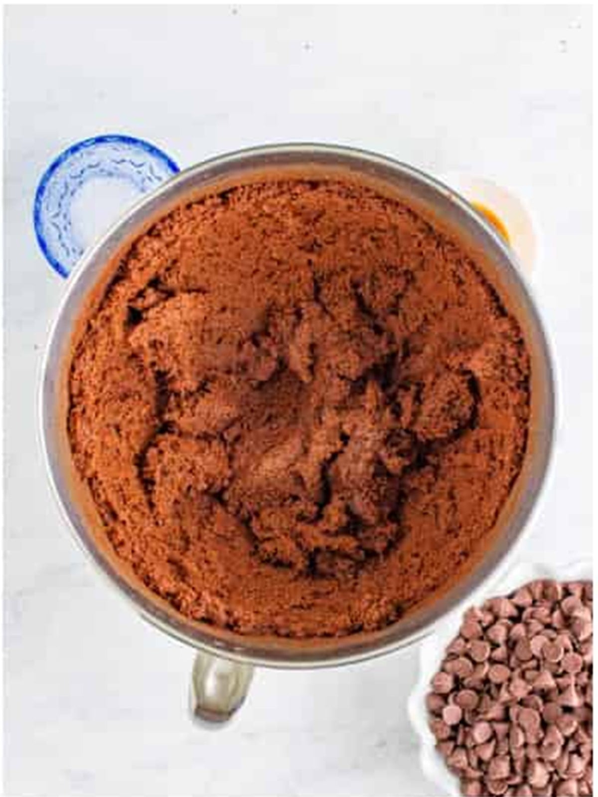 Chocolate chips folded into the thick brownie batter.