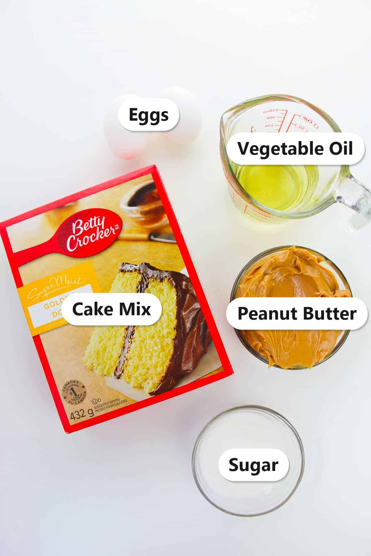 Labeled ingredients needed to make peanut butter cake mix cookies.