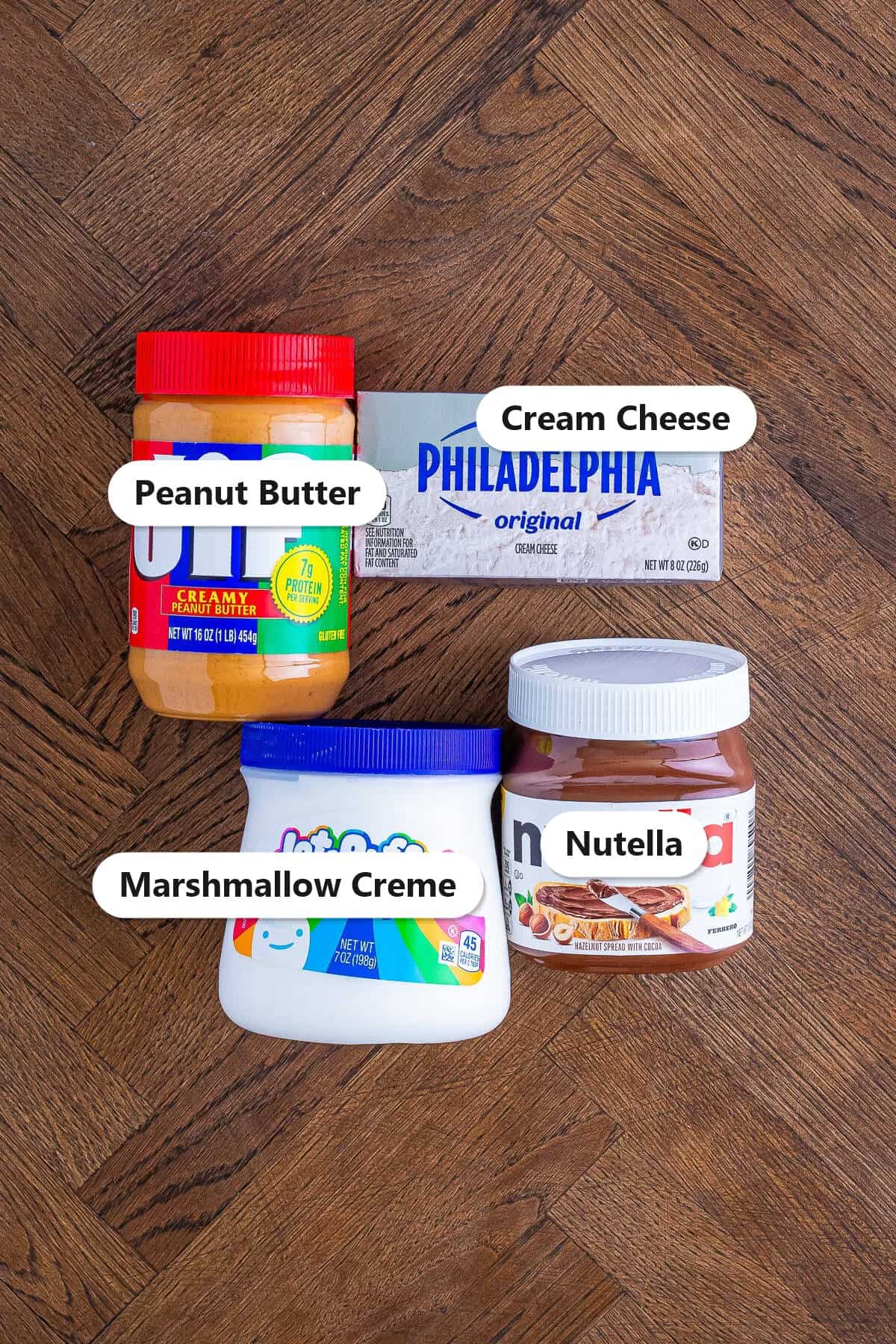Labeled ingredients for peanut butter dip with Nutella including cream cheese, marshmallow creme, peanut butter, and Nutella.