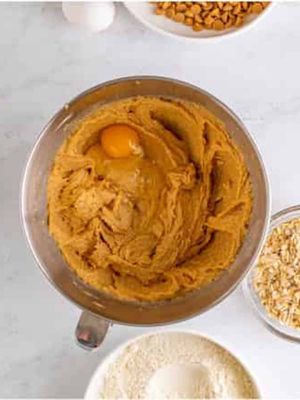 Eggs and vanilla beaten into the peanut butter cookie dough.