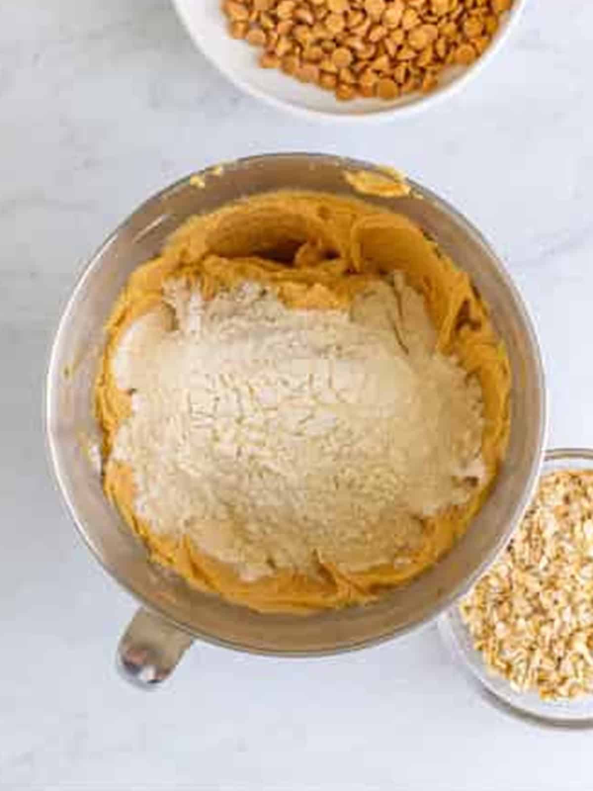 Flour mixture stirred into the peanut butter oatmeal cookie dough.