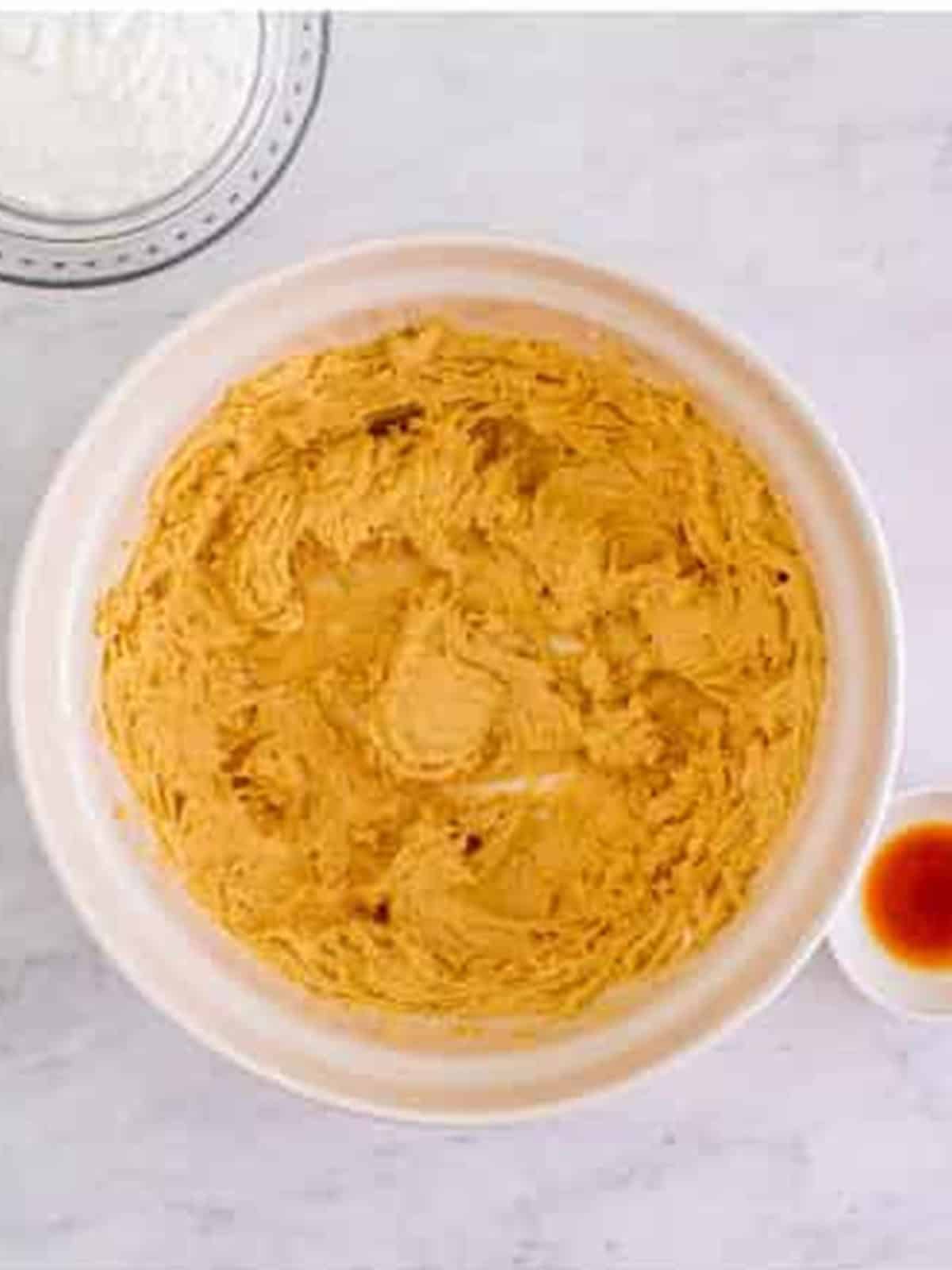 Cream cheese and peanut butter beaten together in a bowl for the pie filling.
