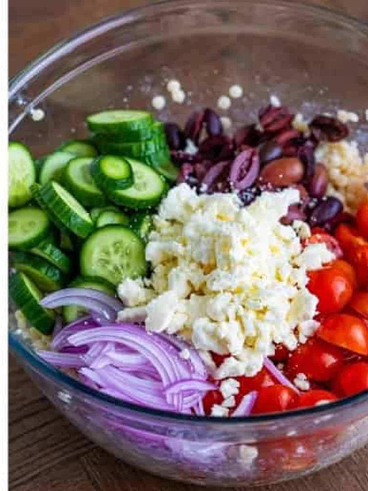 Cucumber, cherry tomatoes, kalamata olives, feta, and red onion added to the couscous bowl.