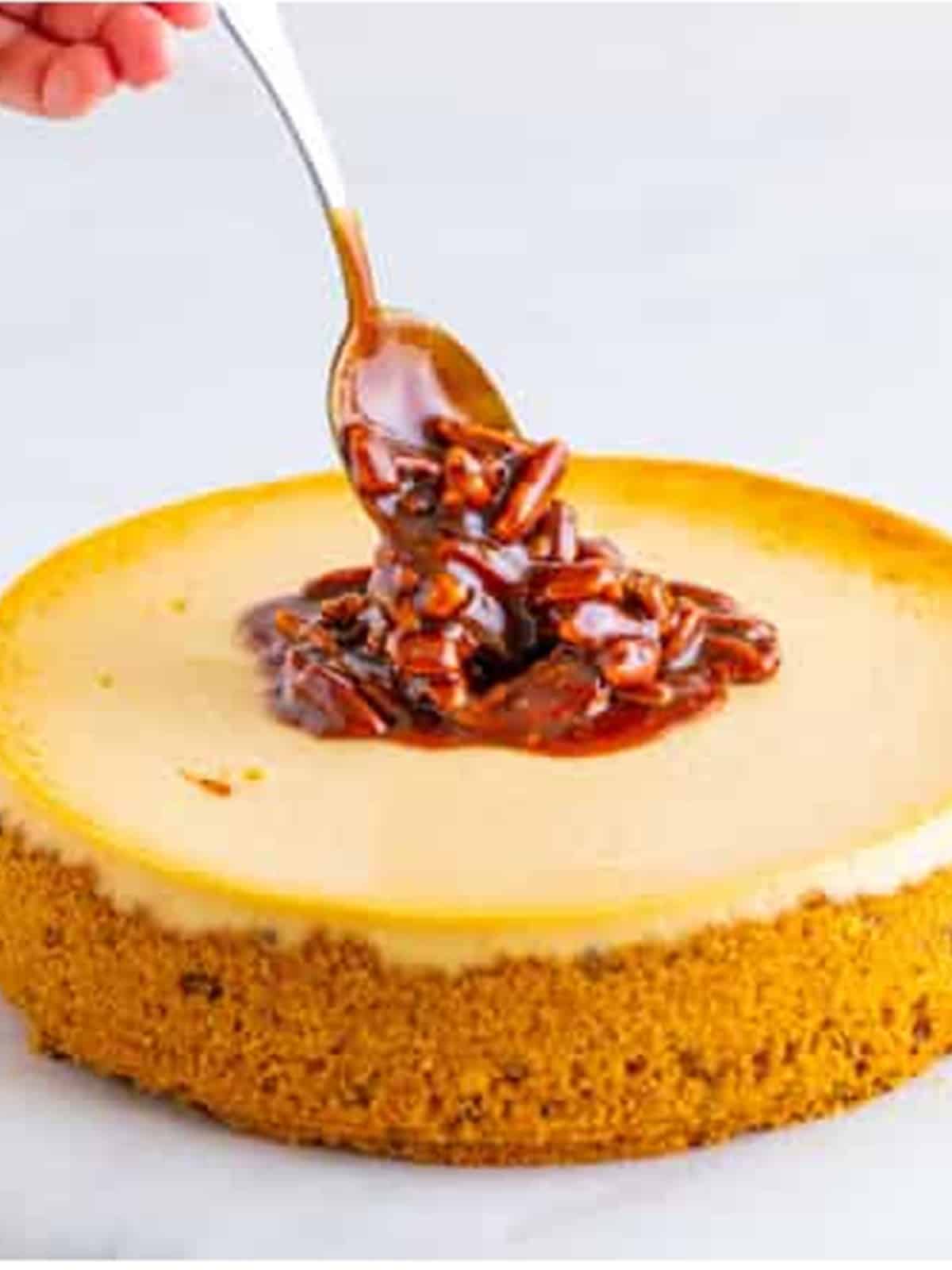 Finished pecan pie cheesecake topped with caramel pecan topping.