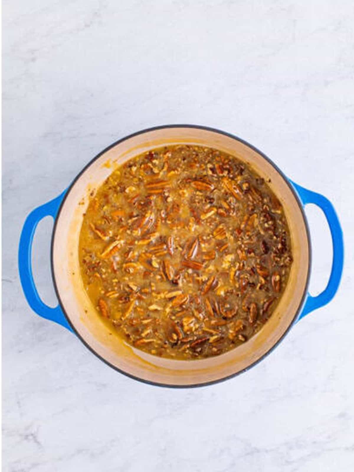 The praline mixture cooked to soft-ball stage and turning golden brown.