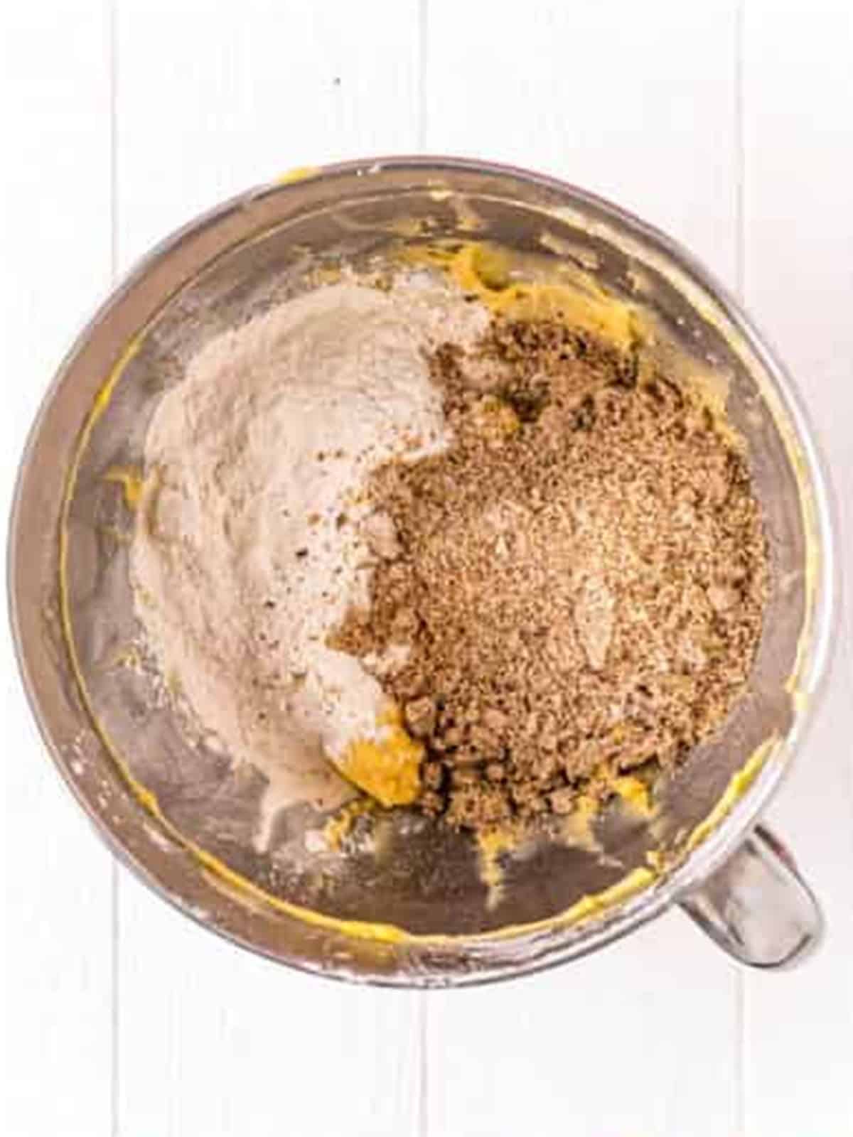 Butter and powdered sugar creamed together in a stand mixer for pecan sandies dough.
