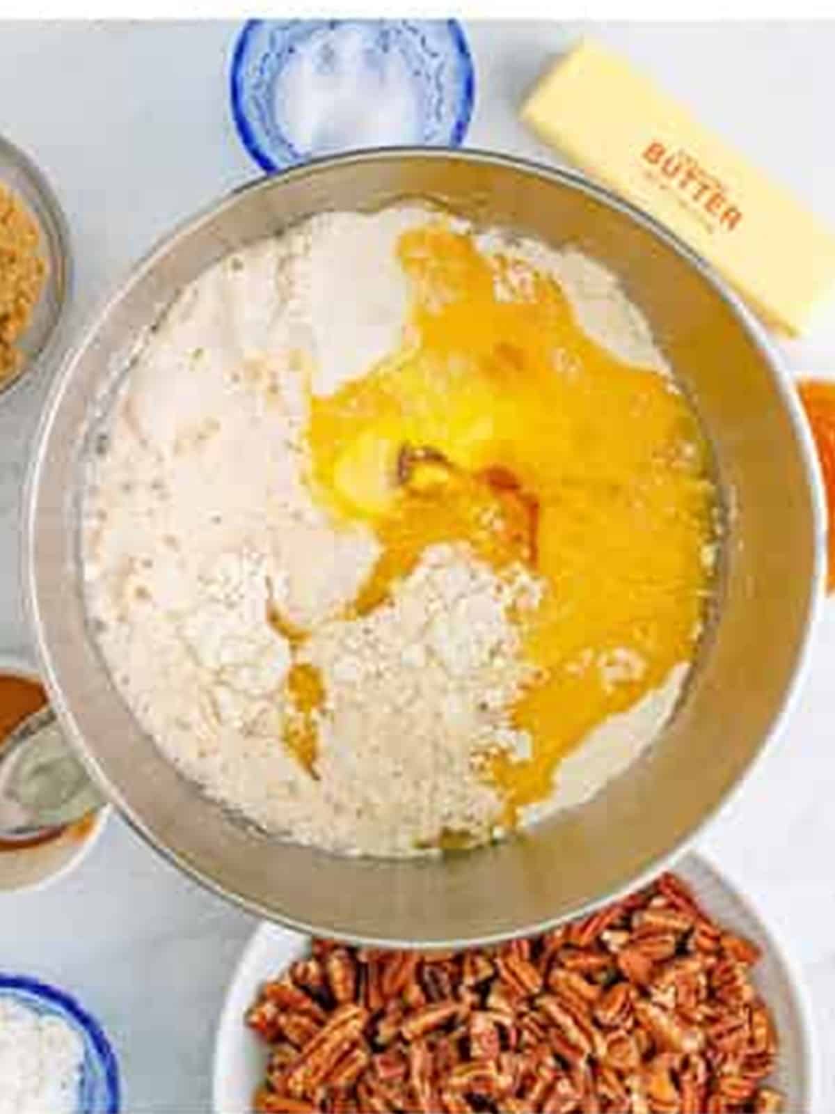 Flour, sugar, eggs, butter, and bloomed yeast combined in a stand mixer bowl to make the dough.