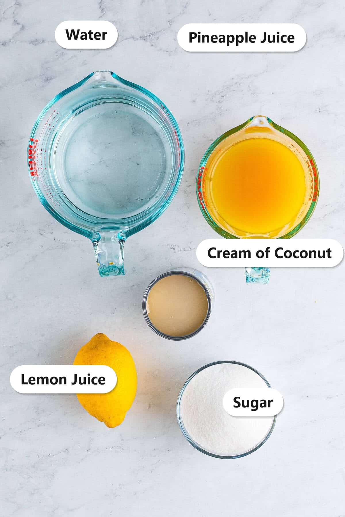 Labeled ingredients for pineapple coconut lemonade including water, pineapple juice, cream of coconut, lemon juice, and sugar.