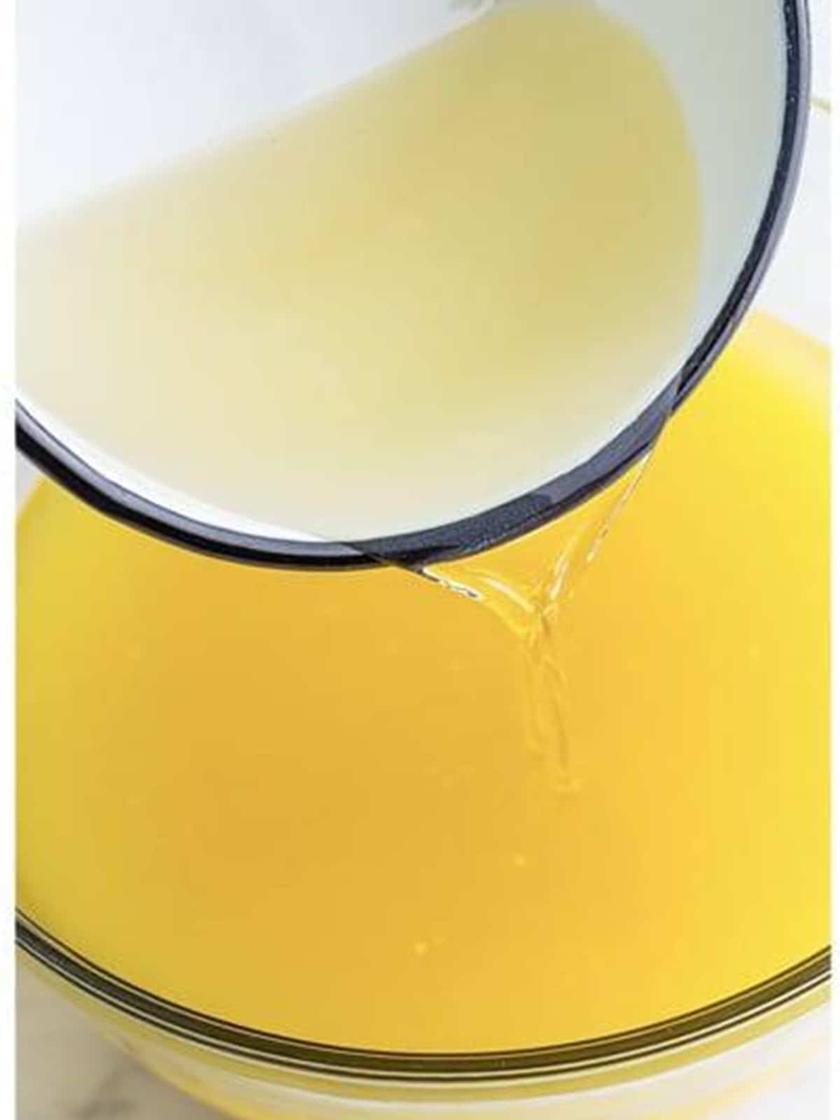 Cooled simple syrup poured into the pineapple coconut lemonade.