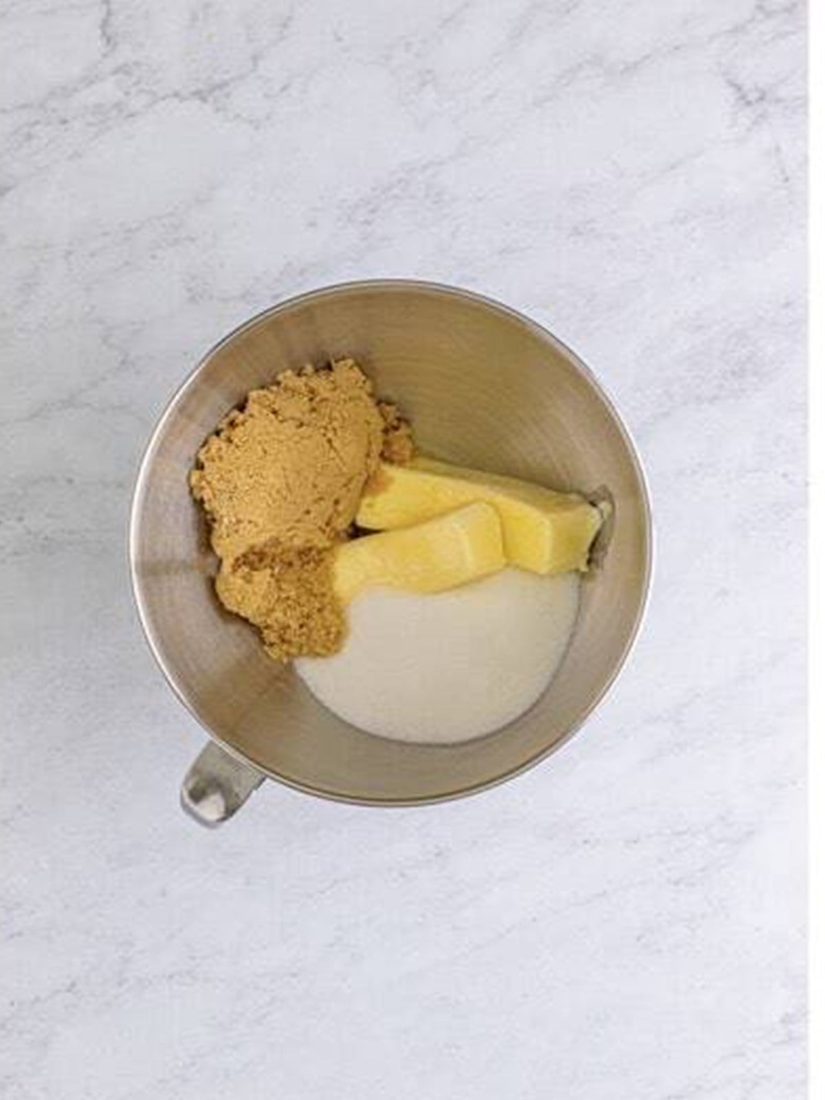 Creaming butter and sugar in a stand mixer for the cupcake batter.