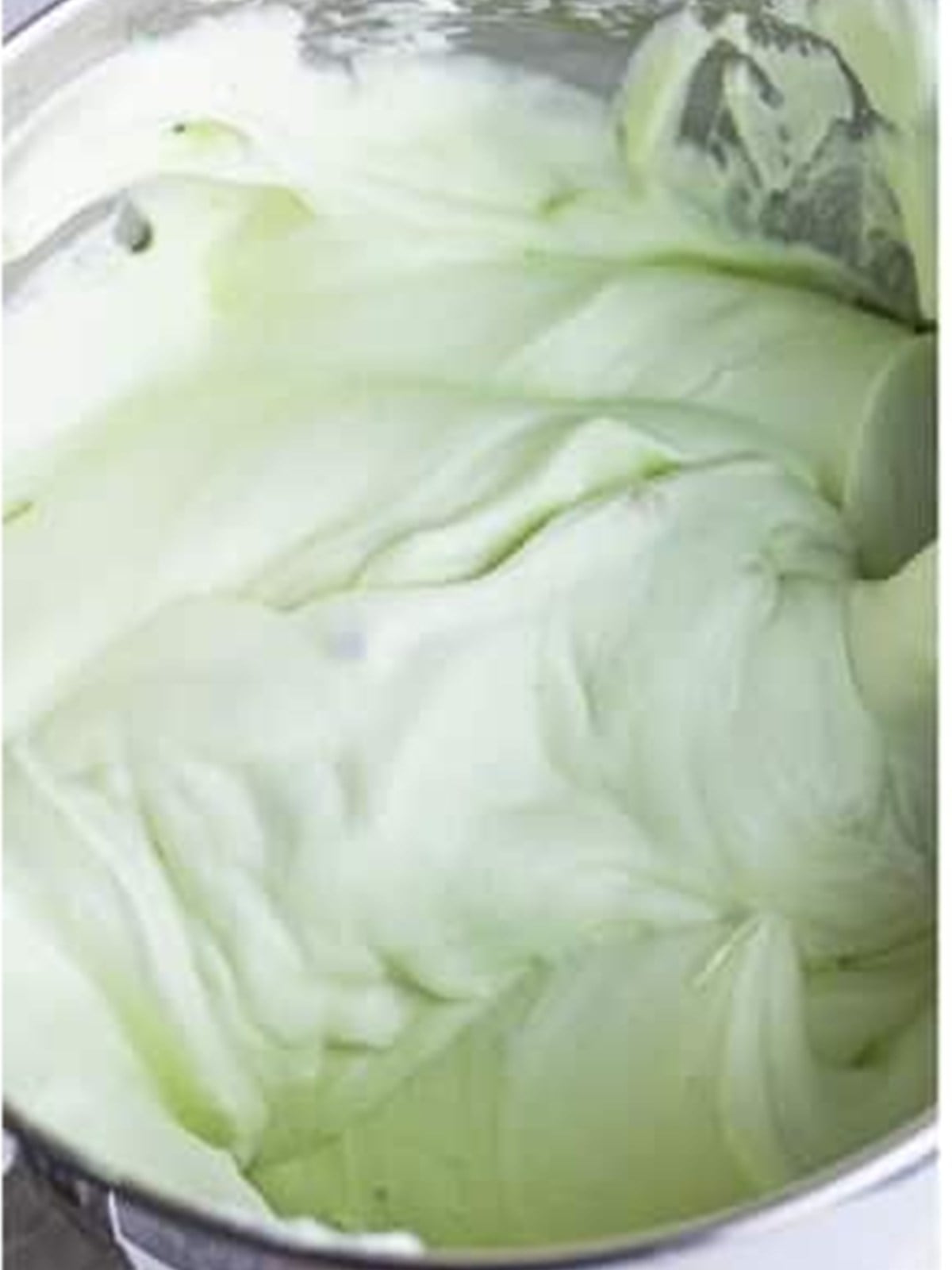 Pistachio pudding base folded into the whipped cream until light green.