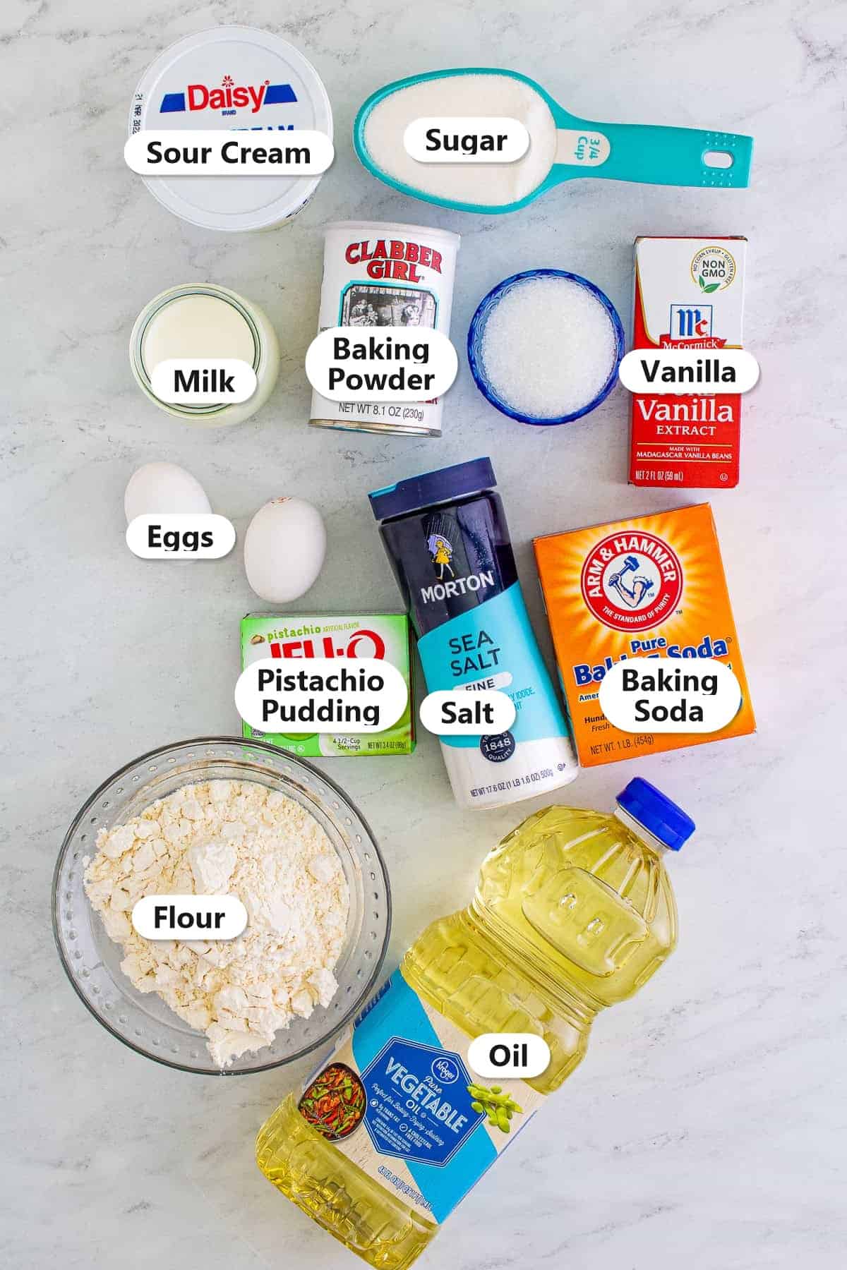 Labeled pistachio muffins ingredients including pistachio pudding mix, flour, sugar, eggs, sour cream, milk, vegetable oil, vanilla, baking powder, baking soda, and salt.