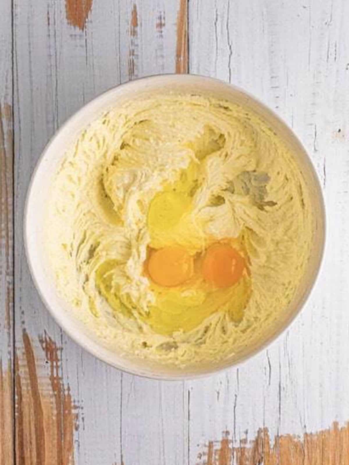 Creaming softened butter and granulated sugar together until fluffy.