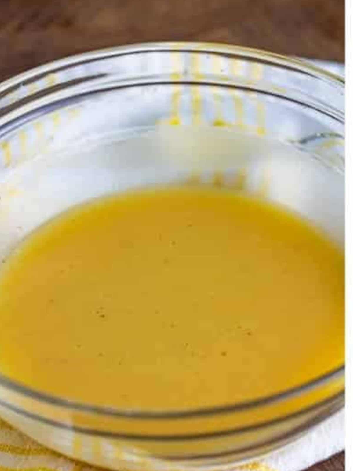 The poppy seed dressing whisked until thick, creamy, and pale.