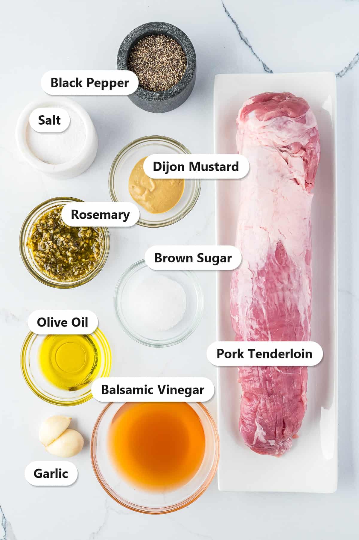 Labeled ingredients for pork tenderloin marinade including pork tenderloin, balsamic vinegar, brown sugar, Dijon mustard, olive oil, garlic, rosemary, salt, and pepper.