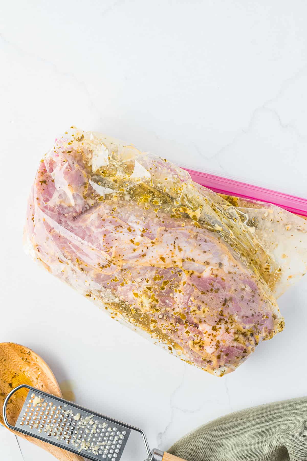 Pork tenderloin marinating in the brown sugar balsamic marinade in a zip top bag.