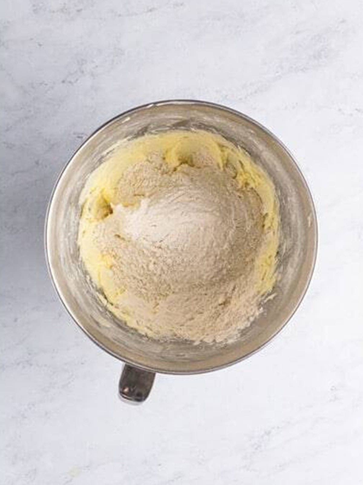 Flour added to the creamed butter and sugar.