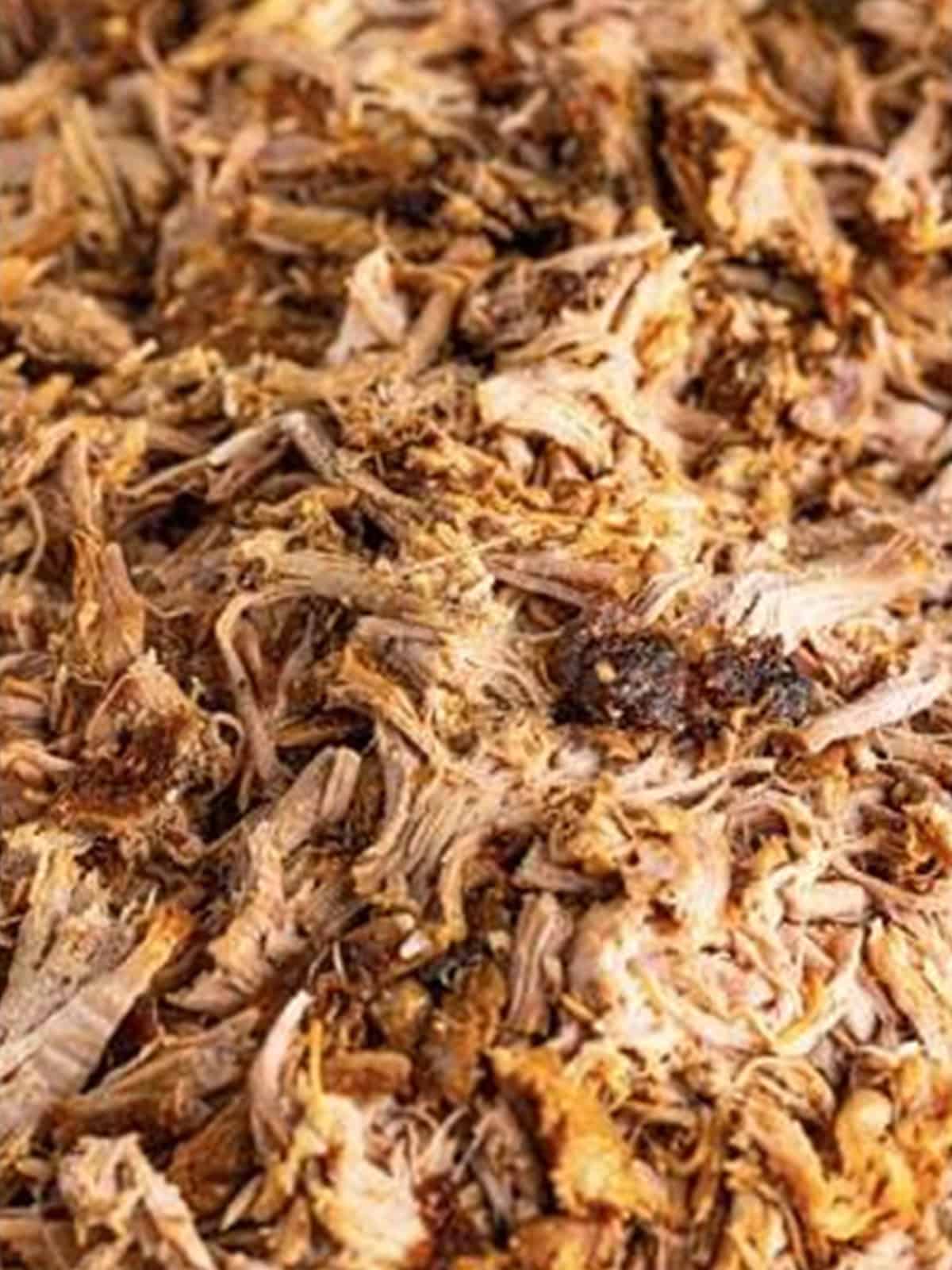 Tender oven baked pork shredded into pulled pork.