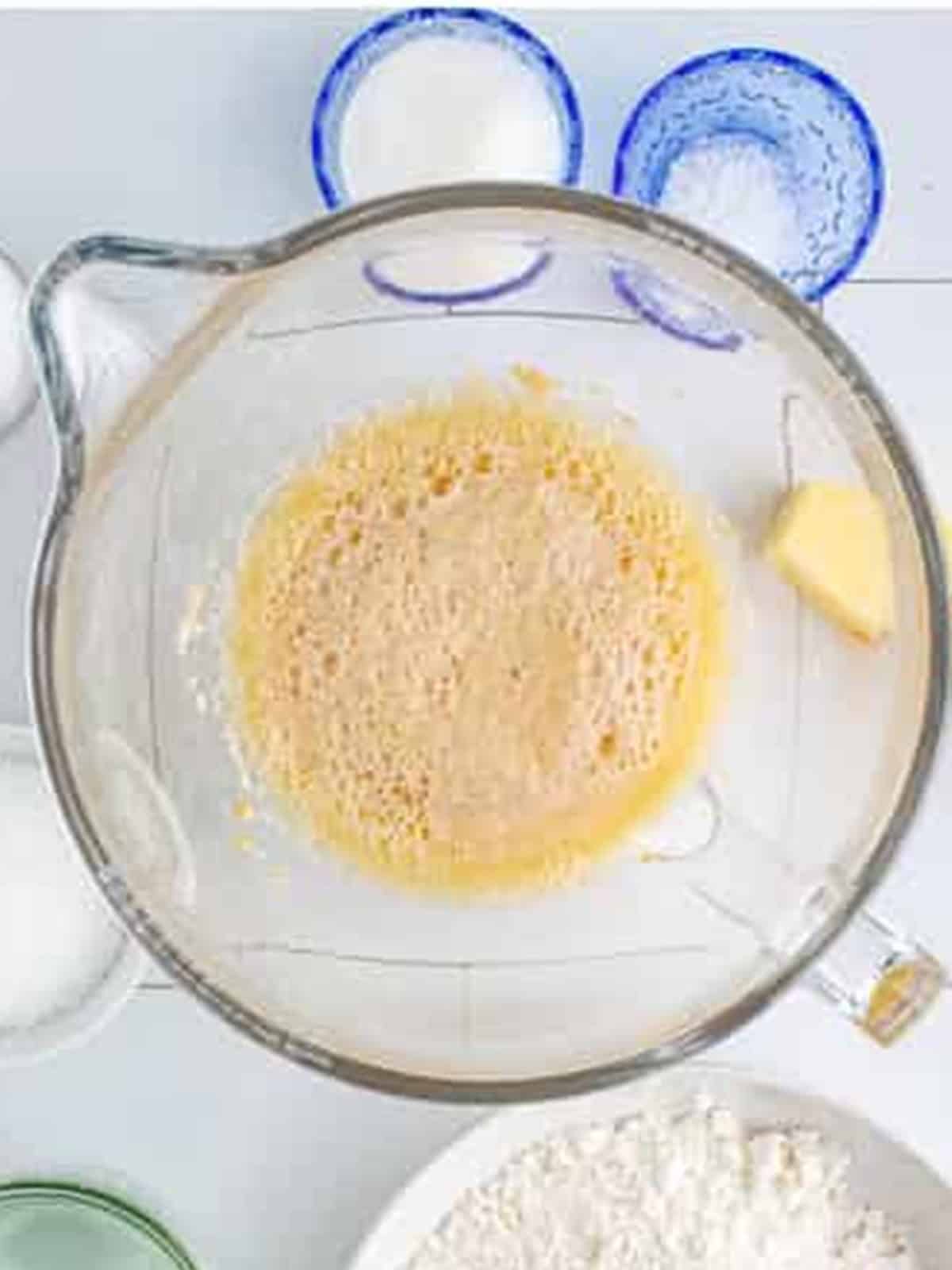 Yeast proofing in warm beer until foamy for homemade soft pretzels.