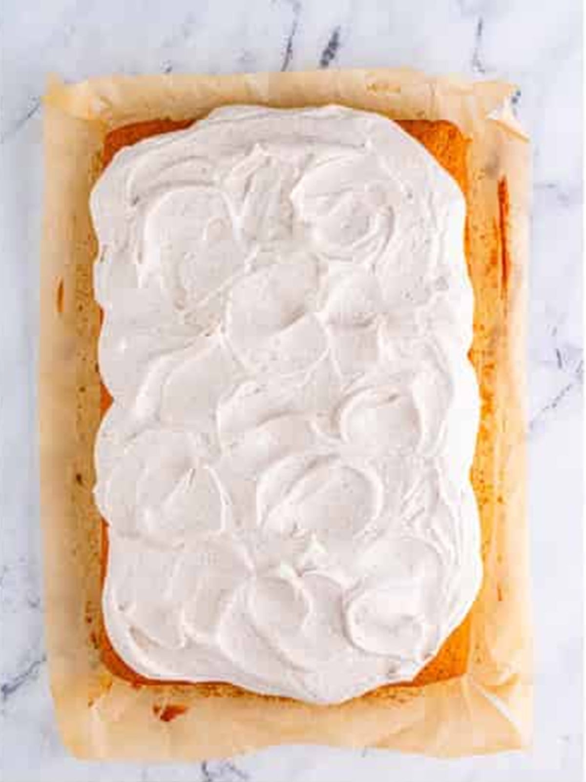 Pumpkin bars topped with a thick layer of cream cheese frosting.
