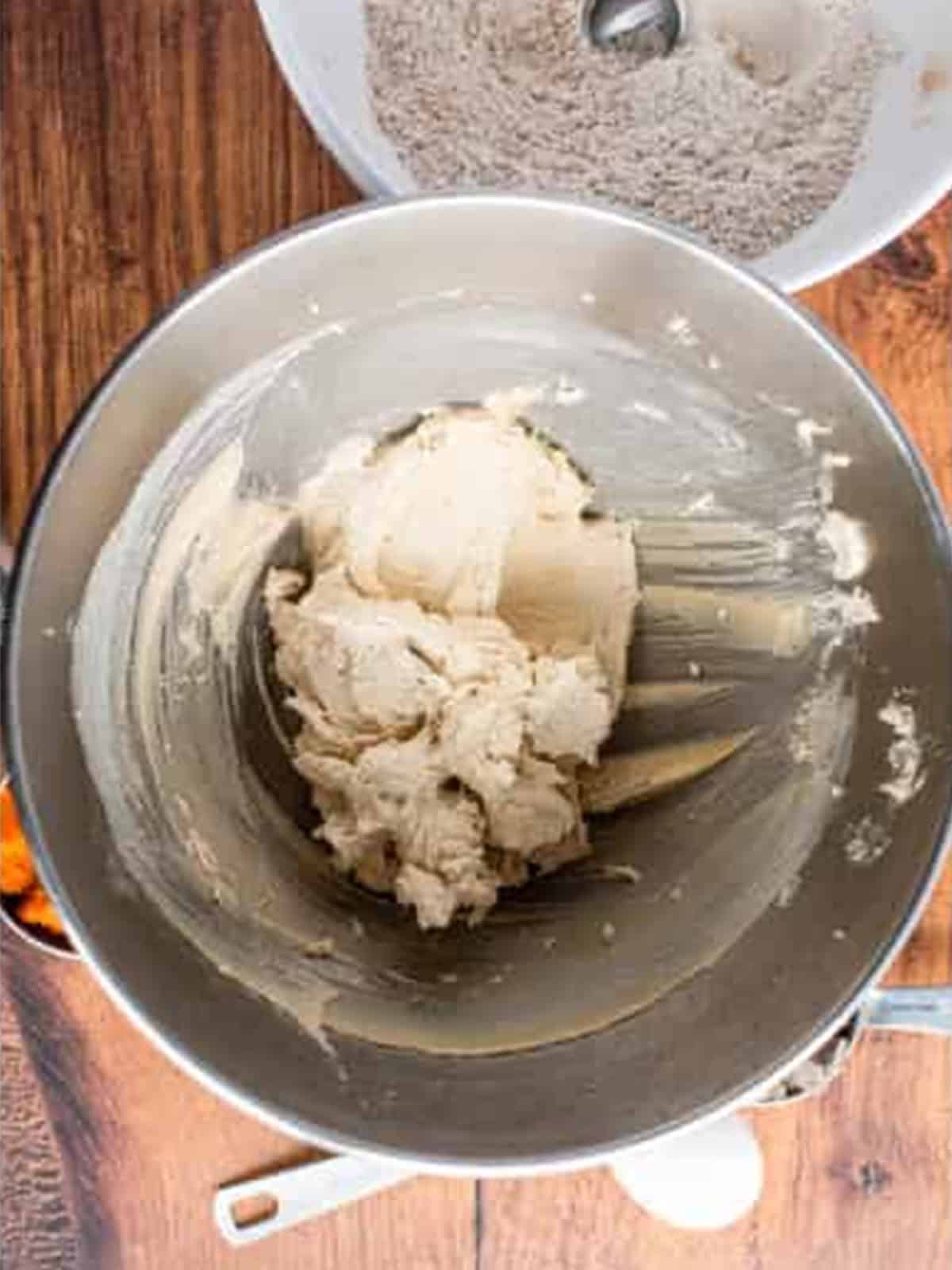 Creaming butter and sugar together in a stand mixer bowl until fluffy.