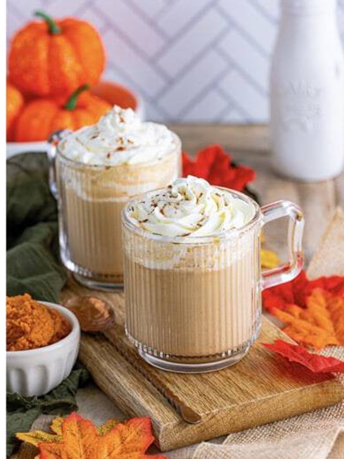 Copycat Starbucks pumpkin spice latte topped with whipped cream and pumpkin pie spice.