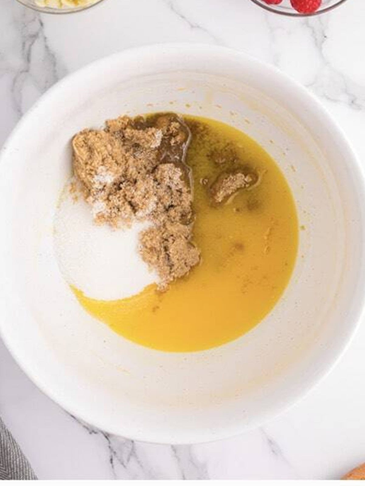 Melted butter, brown sugar, and granulated sugar in a mixing bowl.