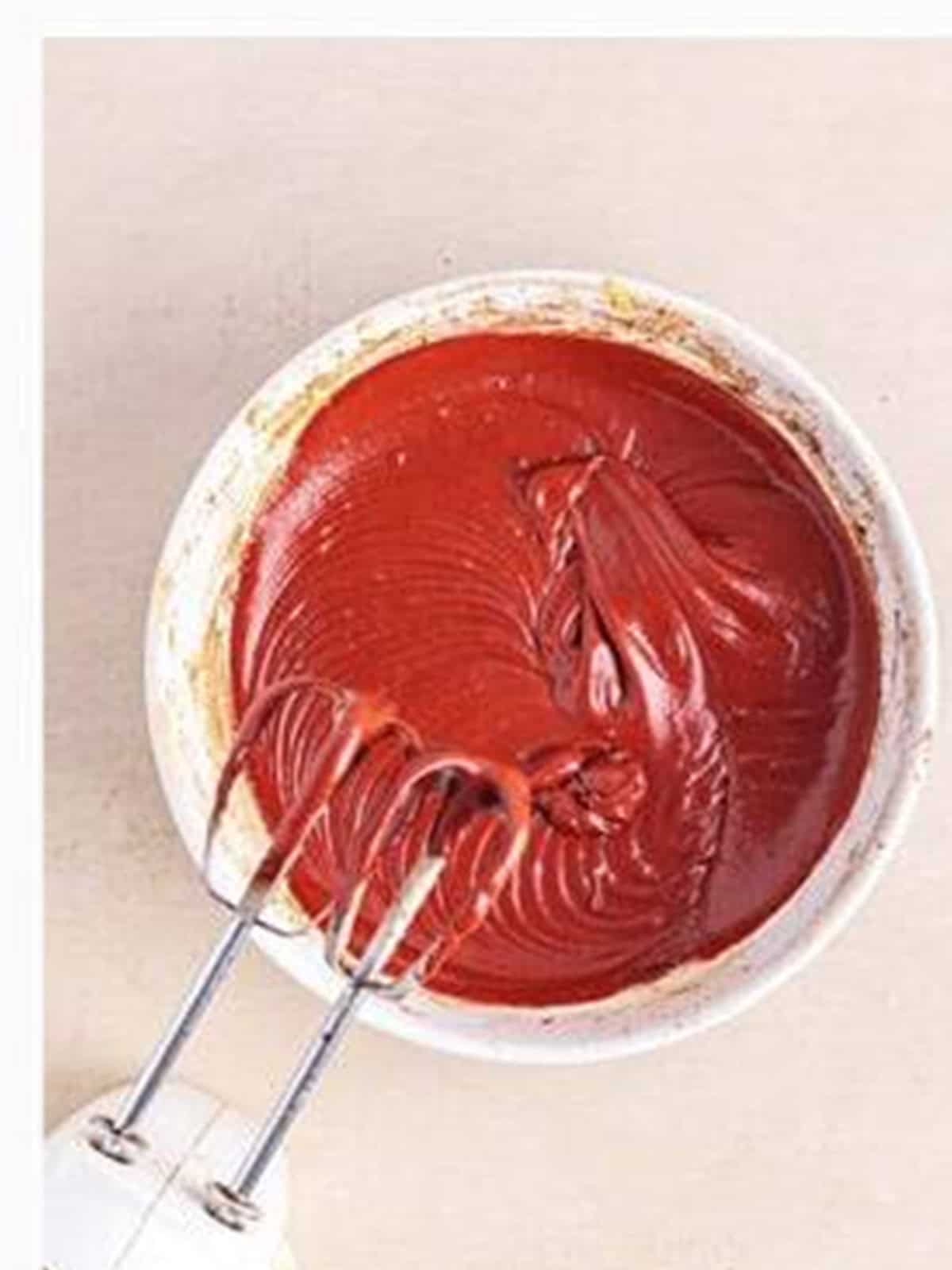 Smooth red velvet brownie batter mixed in a bowl for Red Velvet Brownies.